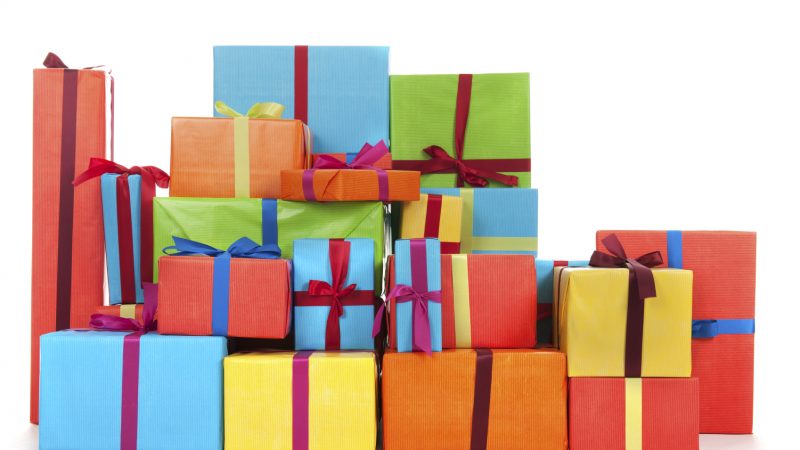 many colorful presents with luxury ribbons isolated over white background